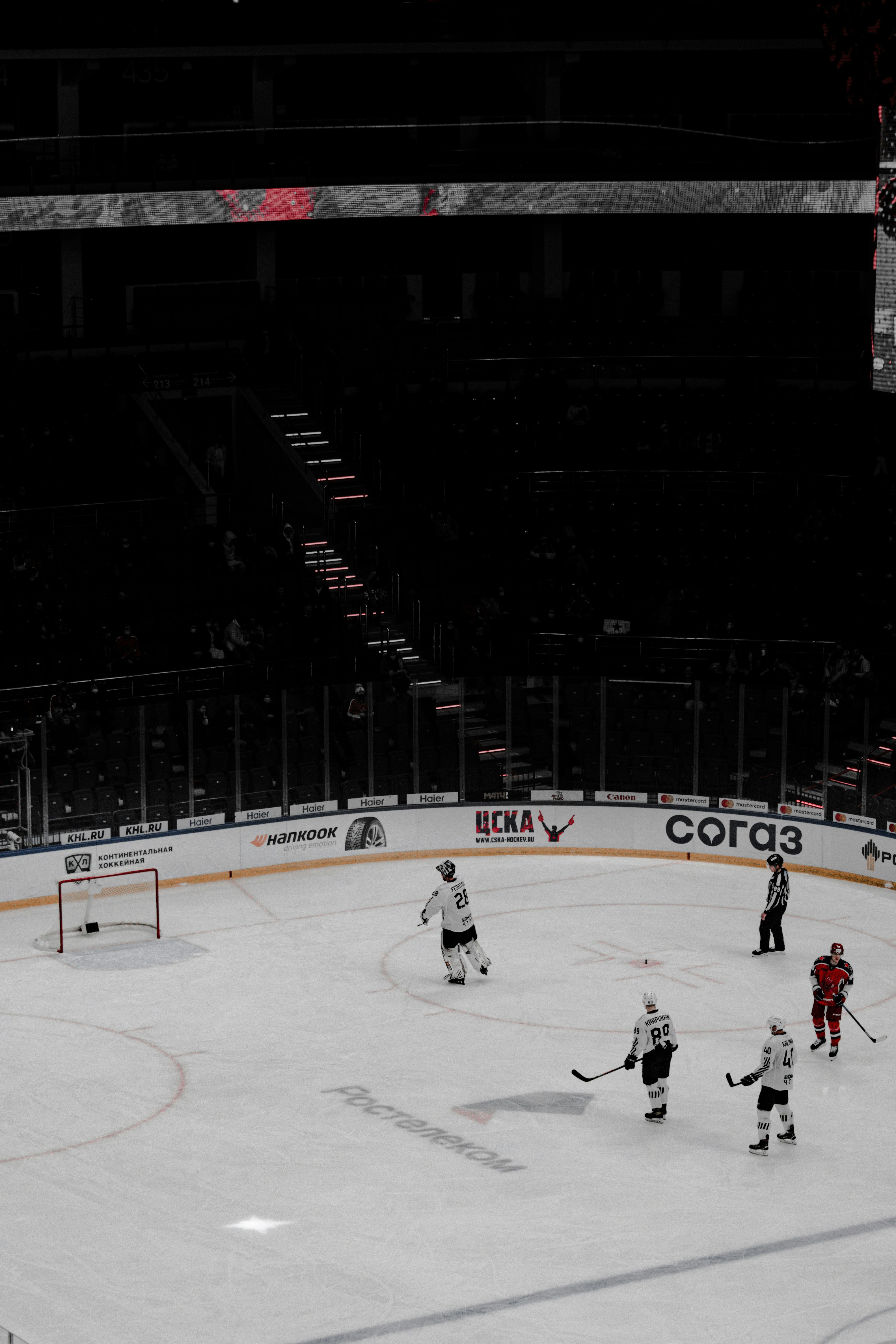 ice hockey players on ice hockey field